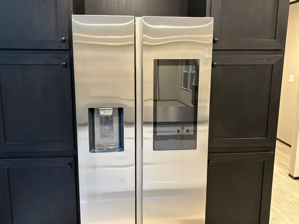 Samsung stainless steel side-by-side touchscreen fridge Image